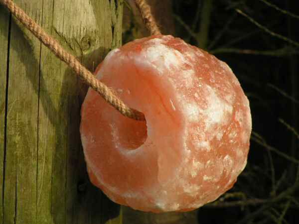 Natural Himalayan salt lick hanging by a rope